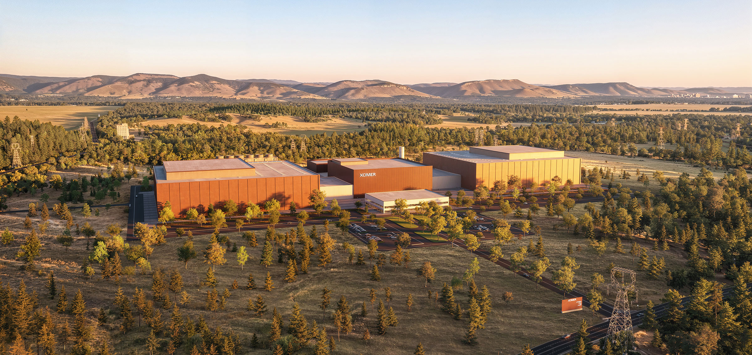 Exterior front-view architectural rendering of the Athena laser fusion power plant campus.