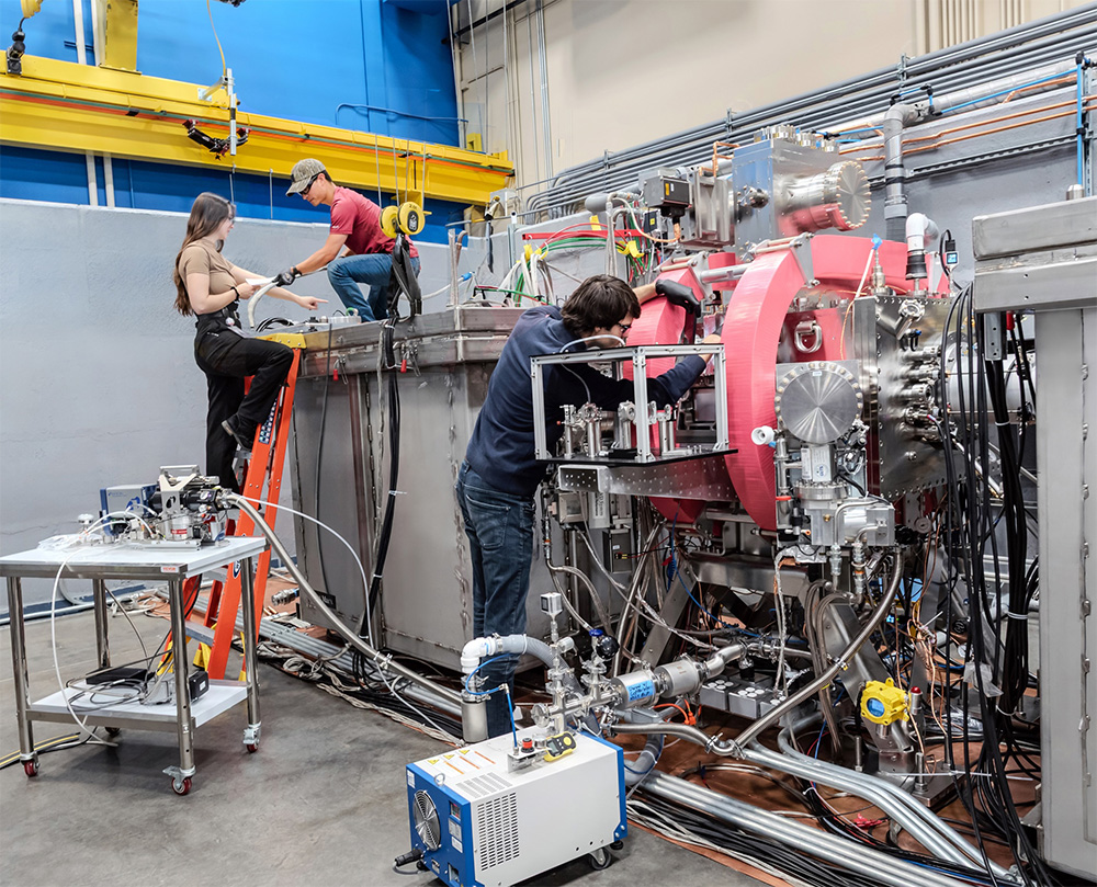 Xcimer Energy Employees work on the LPK laser amplifier.